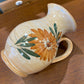 Pichet carafe en terre cuite décor fleurs