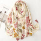 Grand foulard imprimé fleurs avec pompons
